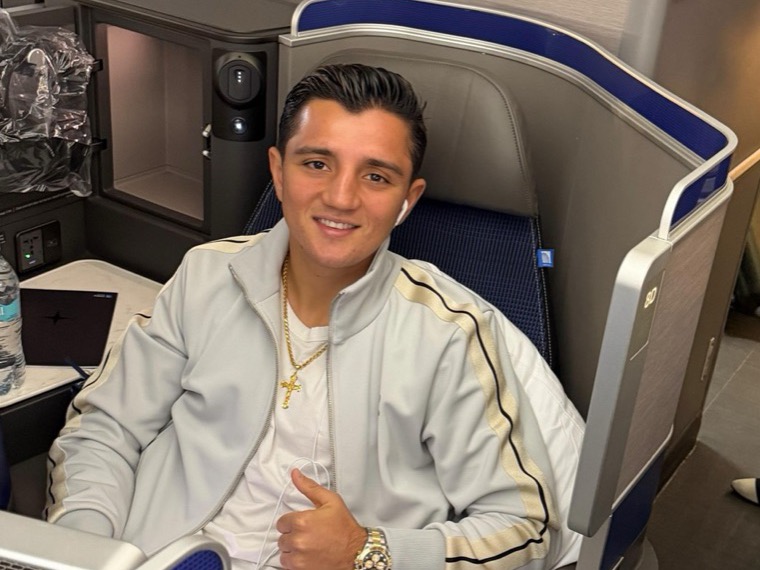 Julius Ballo in a first-class seat on the way to a fight