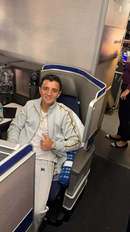 Julius Ballo in a first-class seat
